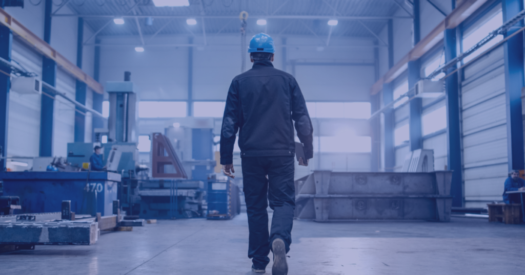 Worker walking in a factory