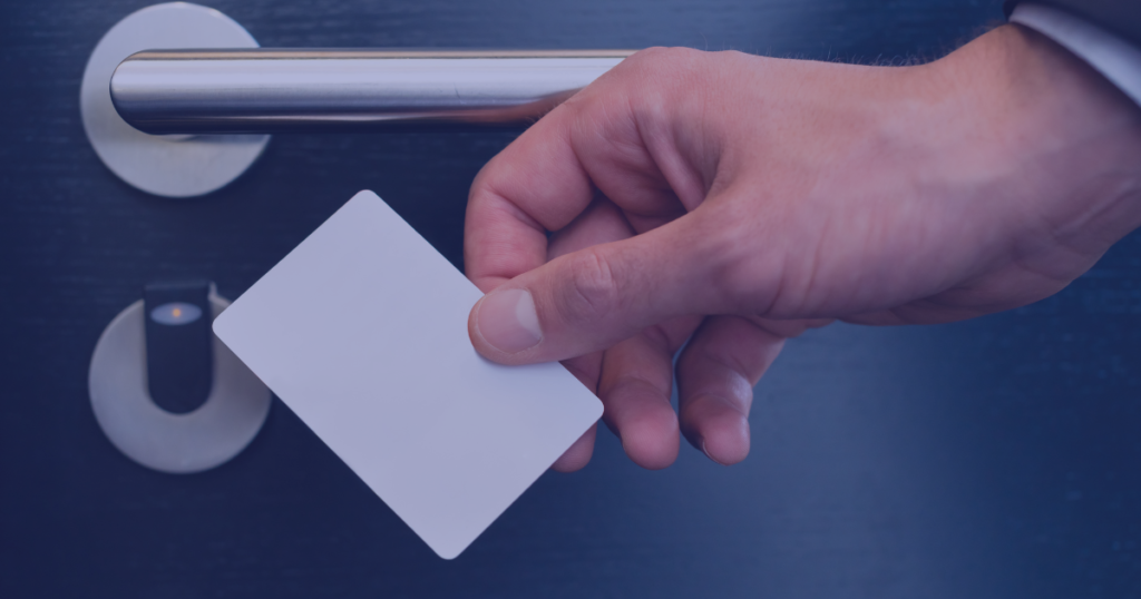 Man using white keycard to gain access to a facility